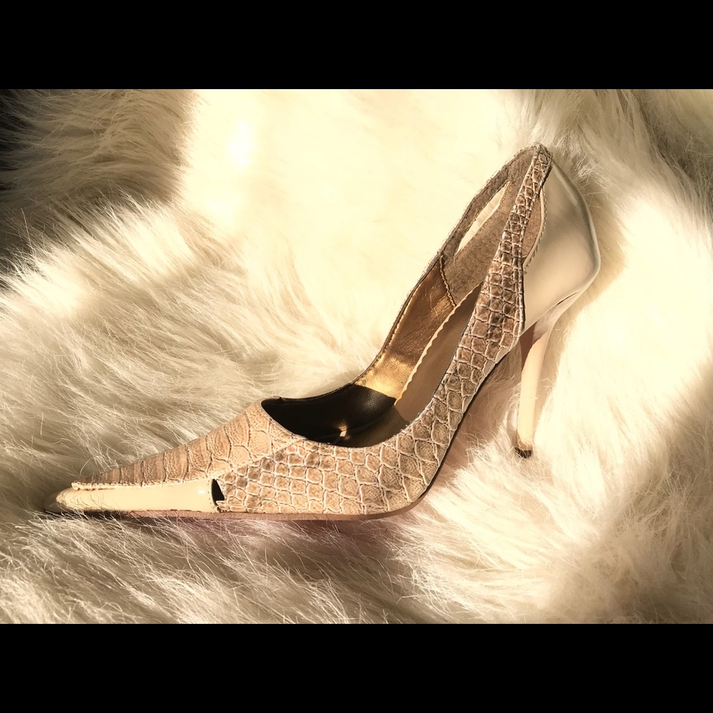 Pointy red bottom python style stilettos. US sz 7